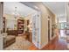 Beautiful home office with custom bookshelves, hardwood floors, and a decorative chandelier at 1454 Carradale Ln, Mount Pleasant, SC 29466