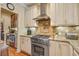 Gourmet kitchen featuring stainless steel appliances, a tiled backsplash and granite counters at 1454 Carradale Ln, Mount Pleasant, SC 29466