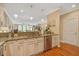 Bright kitchen with granite counters, stainless steel appliances and views to the living area at 1454 Carradale Ln, Mount Pleasant, SC 29466