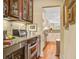 Hallway wet bar with stainless beverage fridge and granite counters at 1454 Carradale Ln, Mount Pleasant, SC 29466