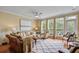 Bright and airy living room with stylish decor, a ceiling fan, and natural light at 1454 Carradale Ln, Mount Pleasant, SC 29466