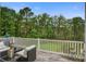 Relaxing outdoor seating area on a spacious deck, perfect for enjoying the scenic view at 1454 Carradale Ln, Mount Pleasant, SC 29466