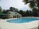 Beautiful pool area with plenty of lounge chairs, greenery and a clubhouse at 1454 Carradale Ln, Mount Pleasant, SC 29466