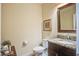 Stylish powder room featuring a granite countertop, modern fixtures, and decorative accents at 1454 Carradale Ln, Mount Pleasant, SC 29466