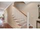 Elegant staircase with hardwood treads and white risers leading to the upper level at 1454 Carradale Ln, Mount Pleasant, SC 29466