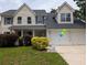 Charming two-story home with a manicured lawn, and a two-car garage at 164 Historic Dr, Mount Pleasant, SC 29464