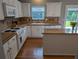 Updated kitchen featuring white cabinets, modern appliances, and a tiled backsplash at 164 Historic Dr, Mount Pleasant, SC 29464