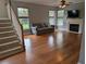 Bright living room featuring hardwood floors, a fireplace, and natural light at 164 Historic Dr, Mount Pleasant, SC 29464