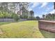 Large backyard with a privacy fence, mature trees, and ample space for gardening and recreation at 165 Clydesdale Cir, Summerville, SC 29486