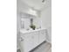 Modern bathroom featuring dual sinks, a large mirror, and white cabinets at 165 Clydesdale Cir, Summerville, SC 29486