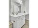 Bright bathroom features white cabinets, a large mirror, and a clean, minimalist design at 165 Clydesdale Cir, Summerville, SC 29486
