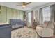 Charming Bedroom with a crib, soft rug, chair, and a decorative name wall at 165 Clydesdale Cir, Summerville, SC 29486
