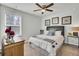 Comfortable bedroom with a ceiling fan, neutral decor, and a window for natural light at 165 Clydesdale Cir, Summerville, SC 29486