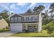 Charming two-story home with stone accents, covered porch and an attached two car garage at 165 Clydesdale Cir, Summerville, SC 29486