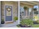 Inviting front porch with stone accents, seating area, and seasonal decorations at 165 Clydesdale Cir, Summerville, SC 29486