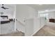 Second story landing features neutral paint and carpet and open access to other rooms at 165 Clydesdale Cir, Summerville, SC 29486