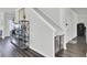 Entry hall with decor, wood floors, and adjacent staircase and baby gate at 165 Clydesdale Cir, Summerville, SC 29486