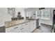 Kitchen island featuring granite countertops, sink, stainless steel dishwasher and seating at 165 Clydesdale Cir, Summerville, SC 29486