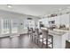 Bright kitchen with white cabinets, granite counters, and seating at the breakfast bar at 165 Clydesdale Cir, Summerville, SC 29486