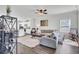 Bright living room with hardwood floors, neutral paint, and views into the kitchen at 165 Clydesdale Cir, Summerville, SC 29486