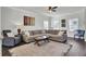 Bright and airy living room featuring a large sectional couch and hardwood floors at 165 Clydesdale Cir, Summerville, SC 29486