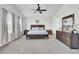 Spacious main bedroom features neutral tones, a ceiling fan, and a large window at 165 Clydesdale Cir, Summerville, SC 29486