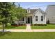 Attractive home featuring a manicured lawn, sidewalk, and inviting front porch for relaxing at 1722 Winfield Way, Charleston, SC 29414