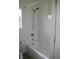 Bathroom featuring a white bathtub, shower with hand held sprayer, window and towel rack at 1755 Central Park Rd # 9103, Charleston, SC 29412