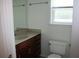 Bathroom showcasing vanity with granite countertop, mirror, toilet and window at 1755 Central Park Rd # 9103, Charleston, SC 29412