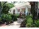 Charming clubhouse surrounded by lush greenery and a welcoming brick-paved walkway at 1755 Central Park Rd # 9103, Charleston, SC 29412