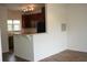 Open kitchen featuring dark cabinets, stainless steel appliances, and a breakfast bar at 1755 Central Park Rd # 9103, Charleston, SC 29412