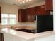 Open kitchen with granite countertops, wood cabinets and stainless steel appliances at 1755 Central Park Rd # 9103, Charleston, SC 29412