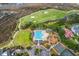 Wonderful aerial view of pool, golf course, basketball court, and parking lot at 1868 Palmetto Isle Dr, Mount Pleasant, SC 29466