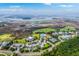 Beautiful aerial view of a community, marshland, golf course, pool and tennis courts at 1868 Palmetto Isle Dr, Mount Pleasant, SC 29466