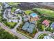 Expansive aerial view of tennis court, swimming pool and golf course at 1868 Palmetto Isle Dr, Mount Pleasant, SC 29466