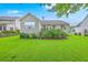 Well-maintained backyard features a lush lawn, tasteful landscaping, and inviting outdoor space at 1868 Palmetto Isle Dr, Mount Pleasant, SC 29466