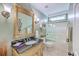 Bathroom with a large decorative mirror, vanity, and tiled shower/tub combo at 1868 Palmetto Isle Dr, Mount Pleasant, SC 29466