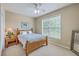 Bedroom with a full-sized bed, ceiling fan, and a bright window at 1868 Palmetto Isle Dr, Mount Pleasant, SC 29466