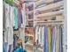 Walk-in closet with built-in shelves and ample storage space for clothing and accessories at 1868 Palmetto Isle Dr, Mount Pleasant, SC 29466