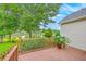 Outdoor deck overlooking a peaceful pond with lush greenery at 1868 Palmetto Isle Dr, Mount Pleasant, SC 29466