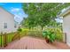 Outdoor deck overlooking a peaceful pond and lush greenery at 1868 Palmetto Isle Dr, Mount Pleasant, SC 29466