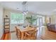 Open dining area features hardwood floors, a large window, and views to the living area at 1868 Palmetto Isle Dr, Mount Pleasant, SC 29466