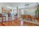 Inviting dining area with wood floors, counter seating, and a modern light fixture at 1868 Palmetto Isle Dr, Mount Pleasant, SC 29466