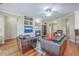 Spacious living area with hardwood floors, fireplace, TV, and comfortable leather furniture at 1868 Palmetto Isle Dr, Mount Pleasant, SC 29466