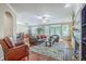Inviting living room featuring hardwood floors, comfortable leather seating, and a cozy fireplace at 1868 Palmetto Isle Dr, Mount Pleasant, SC 29466