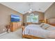 Bright main bedroom features a ceiling fan, natural light, and light-colored furnishings at 1868 Palmetto Isle Dr, Mount Pleasant, SC 29466