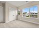 Cozy bedroom with plush carpet and large windows offering natural light and neighborhood views at 198 Winding Branch Dr, Summerville, SC 29486