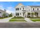 Charming two-story home with a well-manicured lawn, a detached garage, and a welcoming front porch at 198 Winding Branch Dr, Summerville, SC 29486