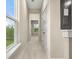 Bright hallway with large window and neutral tones create a calming atmosphere at 198 Winding Branch Dr, Summerville, SC 29486