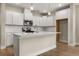 Modern kitchen featuring an island and white cabinets, perfect for entertaining guests at 198 Winding Branch Dr, Summerville, SC 29486